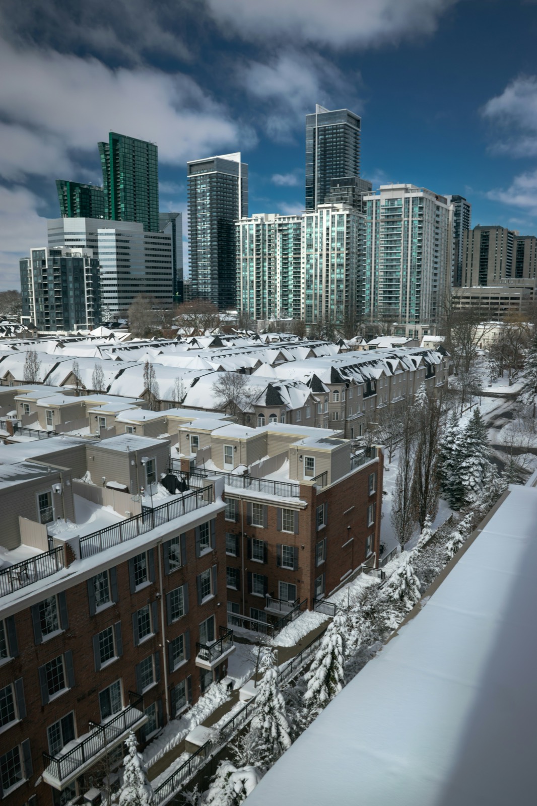 A snowy York Region neighbourhood of townhomes and condo towers